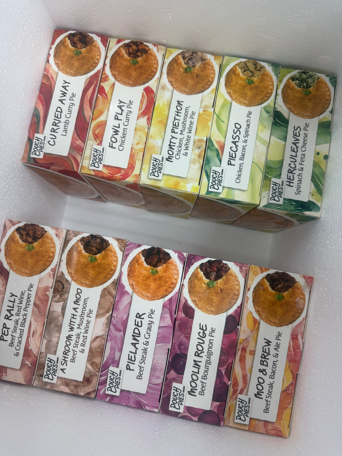 Pouch Pies flavor boxes neatly packed inside an insulated delivery box